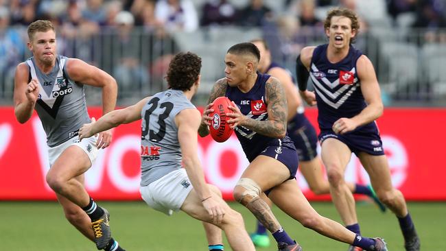 Michael Walters takes on Dan Houston and Darcy Byrne-Jones during Fremantle’s win over Port Adelaide earlier this season. Picture: Paul Kane/Getty Images