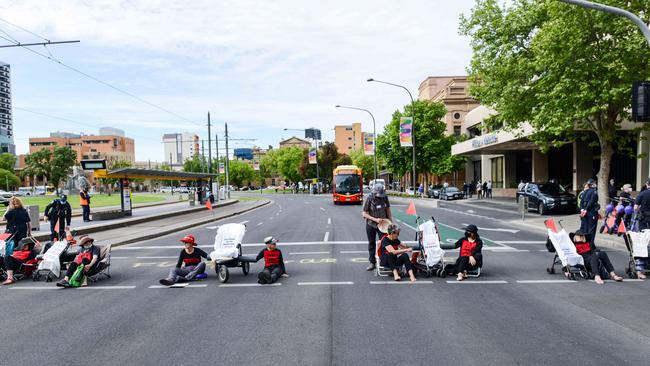 Protesters have glued themselves to prams on Wednesday. Picture: NCA NewsWire/Brenton Edwards