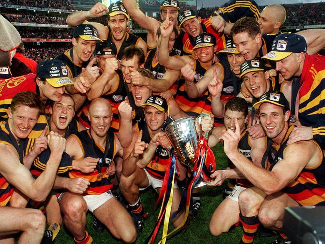 Adelaide Crows footballers with the cup after besting St Kilda in the 1997 grand final.