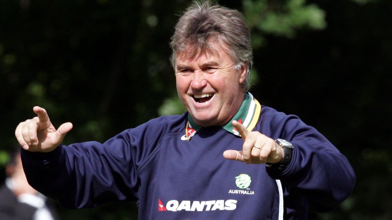 Socceroos coach Guus Hiddink celebrates after he hit crossbar in competition with other coaches for a bottle of wine during Australia team World Cup 2006 training session while in camp in Mierlo, The Netherlands, 29/05/06, before heading off for finals in Germany.