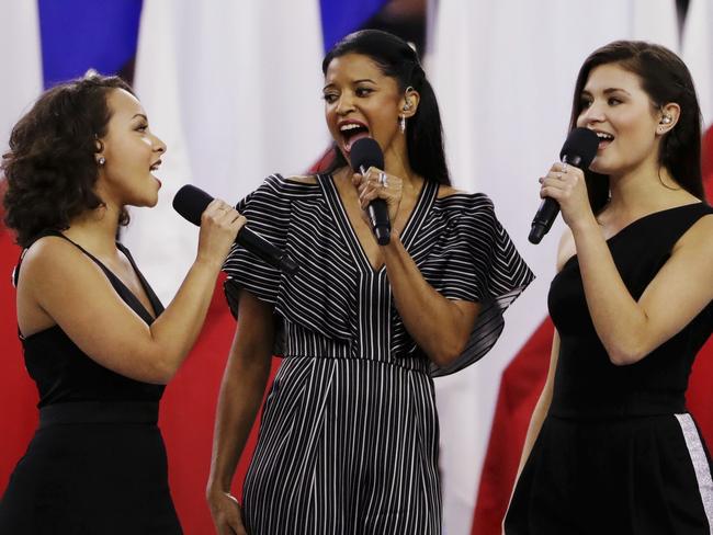 Phillipa Soo, right, Rene Elise Goldsberry (centre) and Jasmine Cephas Jones performed God Bless America before the NFL Super Bowl 51. Picture: AP