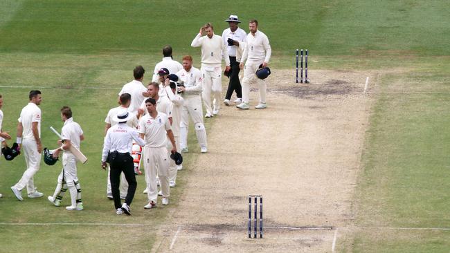 Players shake hands as the match was called a draw late on day five.