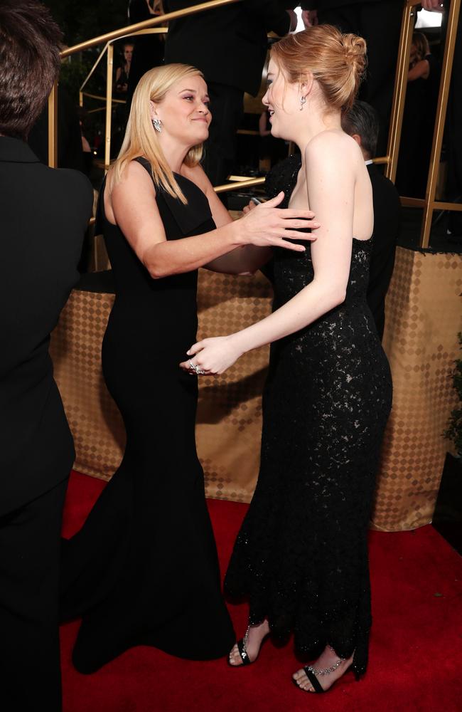 Reese Witherspoon and Emma Stone attend The 75th Annual Golden Globe Awards at The Beverly Hilton Hotel on January 7, 2018 in Beverly Hills, California. Picture: Getty