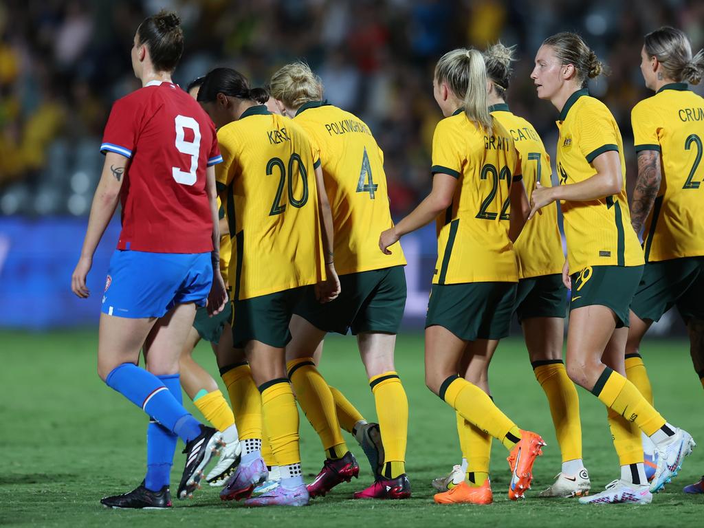 Claire Polkinhorn (4) celebrates with her teammates in Gosford.Photo: Scott Gardiner/Getty Images