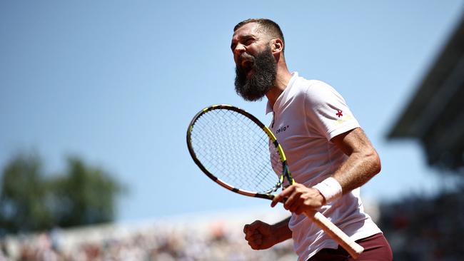 Benoit didn’t go down without a fight. (Photo by Anne-Christine POUJOULAT / AFP)