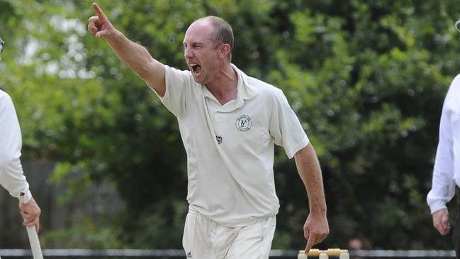 Justin Baker celebrates a wicket.