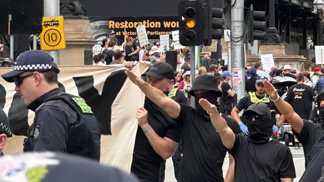 Masked men performed Nazi salutes in Melbourne’s CBD on Saturday. Picture: Twitter