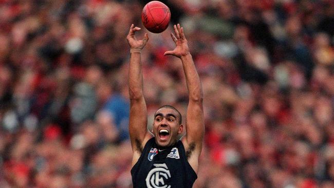 Justin Murphy celebrates as the siren sounds to end the famous 1999 preliminary final win over Essendon.