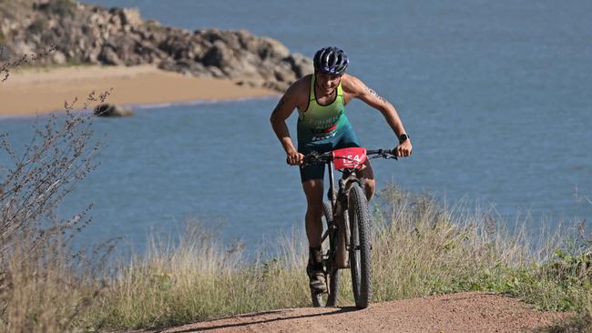 Australia's Tom Fisher powers up the hill away from Shelly Beach during the Elite Cross Duathlon World championships in Townsville. Picture: Stephen Harman.