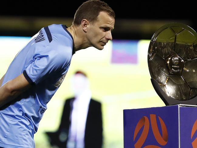 SYDNEY, AUSTRALIA - AUGUST 15: Alex Wilkinson of Sydney FC looks at the Premiers Plate during the round 26 A-League match between Sydney FC and the Western Sydney Wanderers at Leichhardt Oval on August 15, 2020 in Sydney, Australia. (Photo by Ryan Pierse/Getty Images)