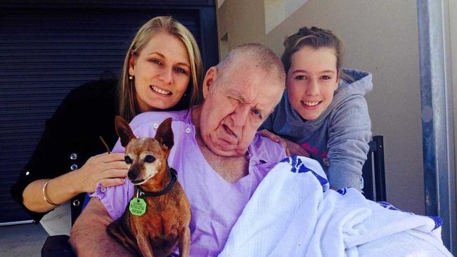 HIS CHOICE: Barry Langbecker with his daughter Denise Kapernick, granddaughter Emily and his dog Bonn. This was the last day Barry was able to be wheeled outside as he wasn't able to be hoisted into his wheelchair again because his pain levels were unmanageable. Eventually, even cutting his fingernails brought him to tears.