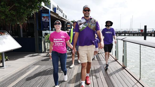 Former regional organiser for the Together Union and new Member for Leichhardt Matt Smith and his partner Renee Kerr walk along the Cairns Marlin Marina boardwalk in the annual Labour Day march, held in Cairns City. Picture: Brendan Radke