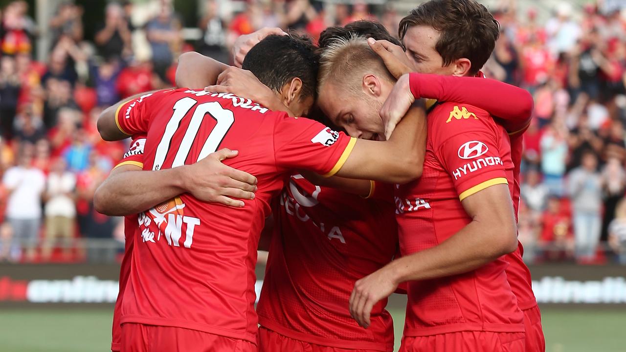 ADELAIDE, AUSTRALIA - DECEMBER 26: United players celebrate a goal by Michal Marrone during the round 12 A-League match between Adelaide United and the Wellington Phoenix at Coopers Stadium on December 26, 2015 in Adelaide, Australia. (Photo by Morne de Klerk/Getty Images)