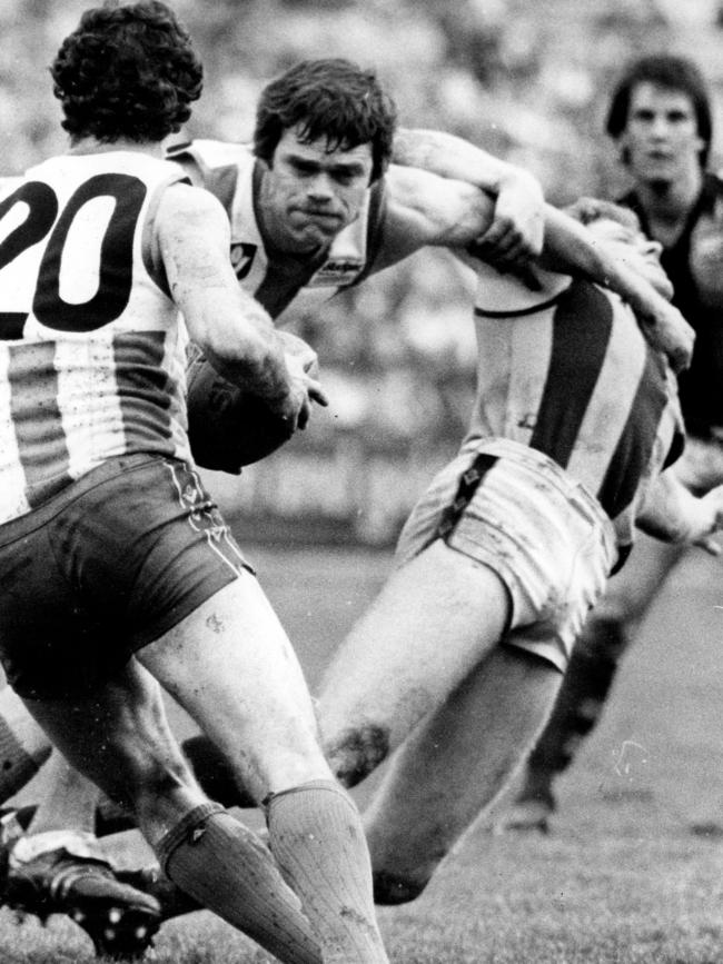 David Dench (centre) in action for the Kangaroos in 1983.