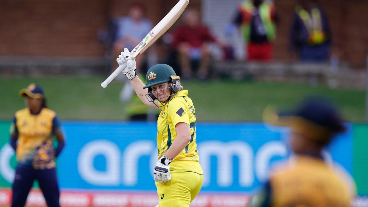 Alyssa Healy celebrates after scoring a half-century. Picture: Marco Longari / AFP