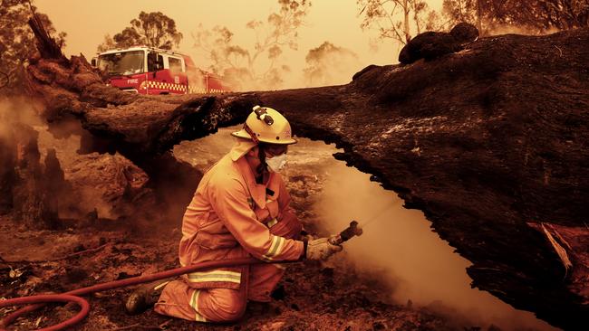 Fire crews put out spot fires in Sarsfield. Picture: Getty Images