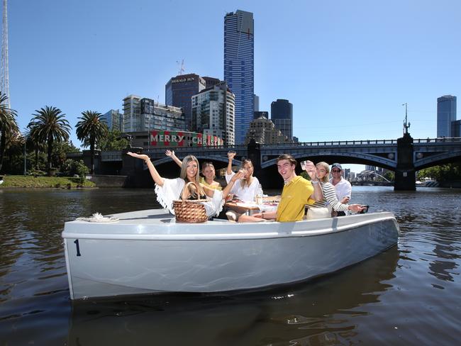 Nina Marucchi, Maddison Cuthill, Leah Thorpe, Alex Marucchi, Georgia McGregor and Nick Tyrrell picnic on the Yarra. Picture: David Caird