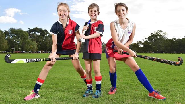 Burnside Hockey Club members Abbie, 11, and Max, 7, with Adelaide Hockey Club member Olivia, 14. Picture: Keryn Stevens