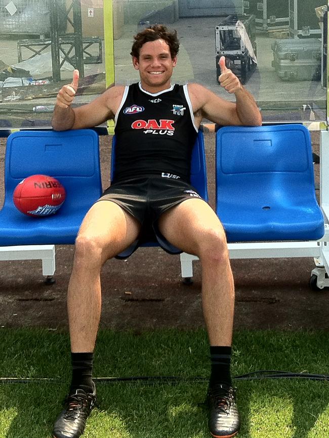 Steven Motlop in Shanghai takes a breather at Port Adelaide training at Jiangwan Stadium. Picture: Michelangelo Rucci