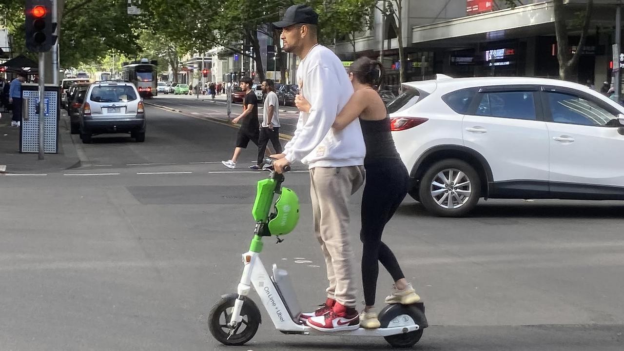 Australian tennis player Nick Kyrgios riding a e-scooter on Elizabeth street in Melbourne, Sunday, January 15, 2023. (AAP Image/James Ross) NO ARCHIVING