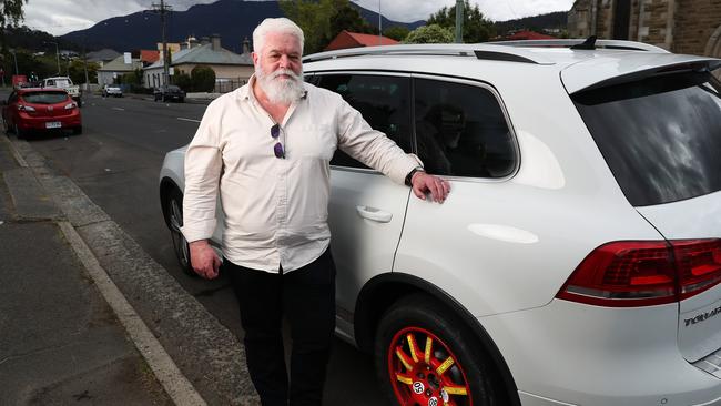 Peter Krause with the space saver tyre he now has to use after a blowout on Davey St. Picture: Nikki Davis-Jones