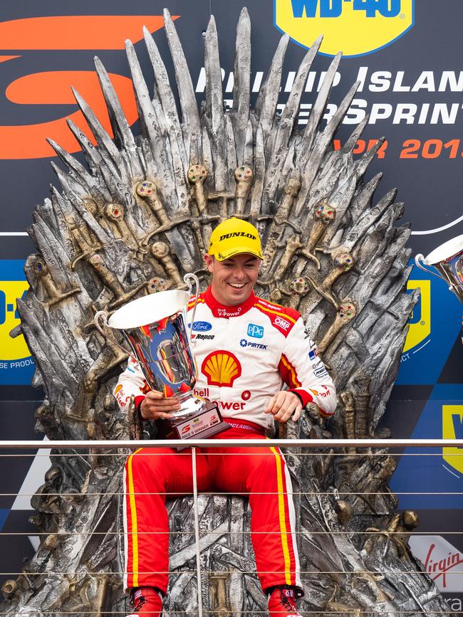 Ford driver Scott McLaughlin celebrates his win at Phillip Island on Saturday on a replica of the Game of Thrones ‘Iron Throne.’ Picture: Getty Images