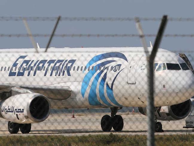 FILE - In this Tuesday, March 29, 2016, file photo, the hijacked aircraft of Egyptair after landing at Larnaca airport, Cyprus. A similar Airbus A320 EgyptAir plane from Paris to Cairo carrying 66 people disappeared from radar early Thursday morning, the airline said. EgyptAir Flight 804 was lost from radar at 2:45 a.m. local time when it was flying at 37,000 feet, the airline said. It said the Airbus A320 had vanished 10 miles (16 kilometers) after it entered Egyptian airspace. (AP Photo/Petros Karadjias, File)
