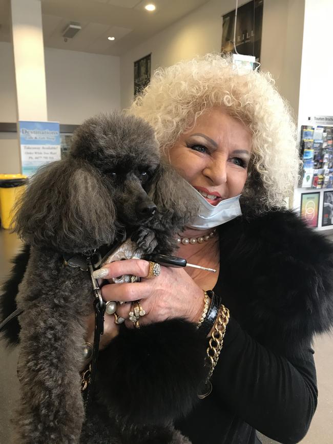 Zach the poodle and Valerie Sherriff-Tandy after arriving at Devonport airport