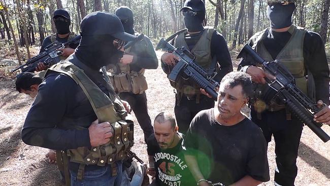 Members of the Jalisco New Generation cartel (CJNG) record themselves with prisoners from a rival cartel. Picture: YouTube