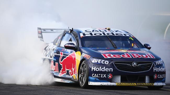 MELBOURNE, AUSTRALIA - SEPTEMBER 16: Jamie Whincup driver of the #1 Red Bull Holden Racing Team Holden Commodore ZB does a burnout after winning the Supercars Sandown 500 at Sandown International Motor Raceway on September 16, 2018 in Melbourne, Australia. (Photo by Mike Owen/Getty Images)