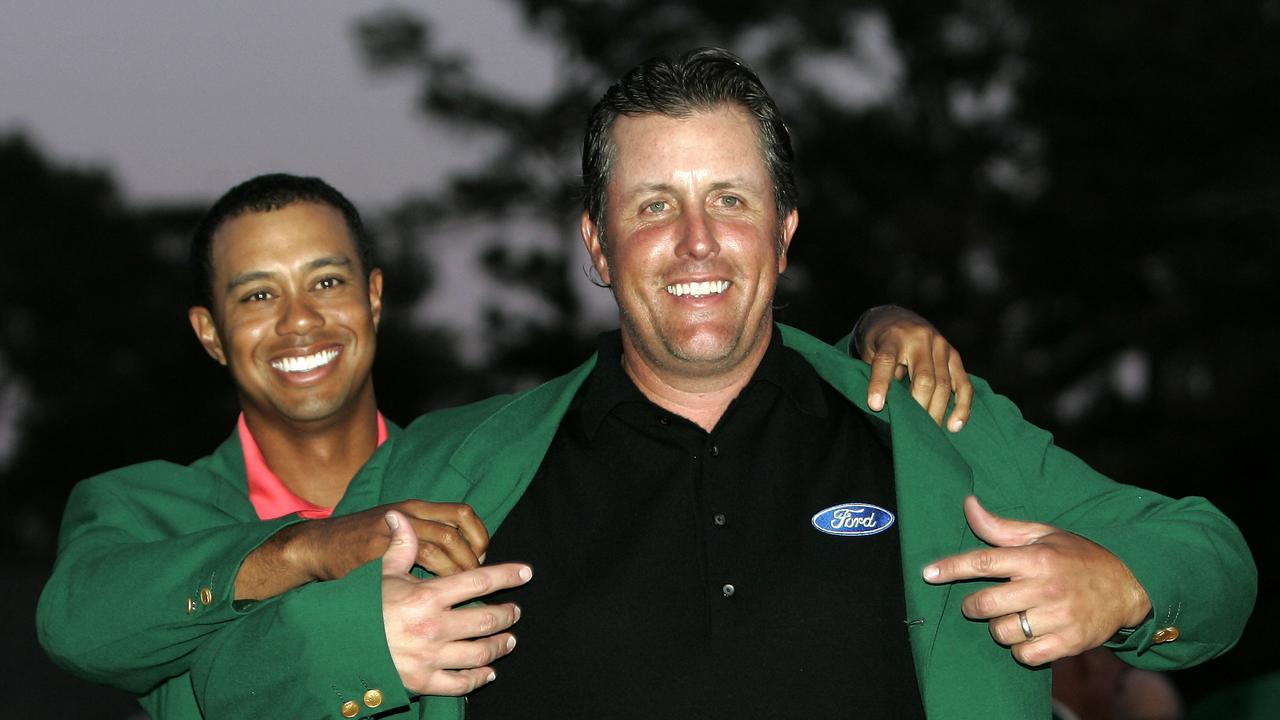 Phil Mickelson (R) and Tiger Woods will miss the Masters. Photo: AP