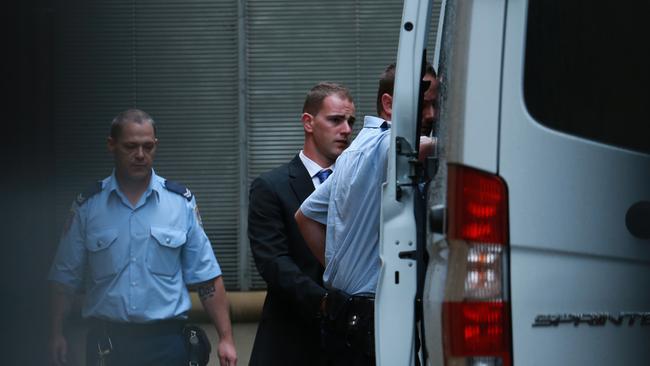 Mitchell Barbieri is escorted to court. Pictures: AAP