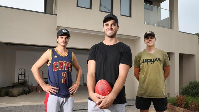 The Neagle brothers, from left, Matthew, Jydon and Jaxon, when they arrived in Adelaide to play for Central District in 2019. (AAP Image/Dean Martin)