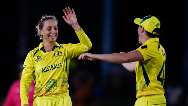 Australia's Ashleigh Gardner (L) celebrates after the dismissal of New Zealand's Lea Tahuhu.