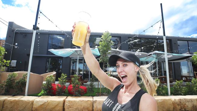 Owner Gemma Roberts raises a glass to the opening. Picture Glenn Hampson