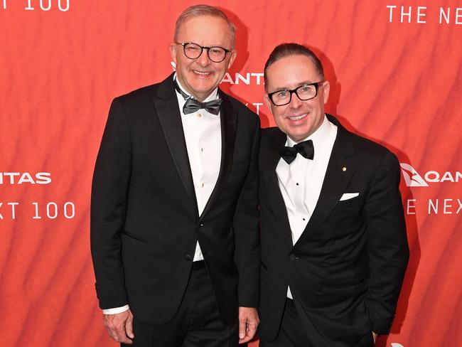 SYDNEY, AUSTRALIA - MARCH 31: Australian Prime Minister Anthony Albanese (L) stands with Qantas CEO Alan Joyce as they attend the Qantas 100th Gala Dinner at Jetbase 96 hangar at Sydney's International Airport on March 31, 2023 in Sydney, Australia. (Photo by James D. Morgan/Getty Images)