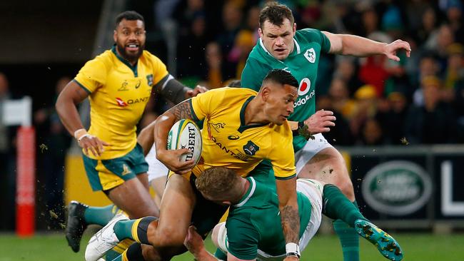 Israel Folau of the Wallabies is tackled at AAMI Park in Melbourne.