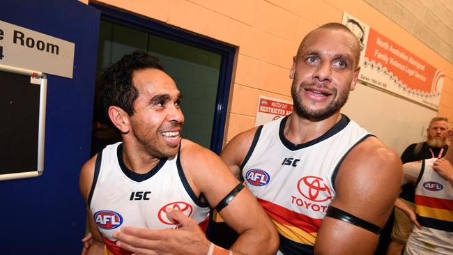 Eddie Betts (left) and teammate Cam Ellis-Yolmen of the Crows celberate winning the Round 11 match against Melbourne in Darwin. Picture: AAP Image/Dan Peled