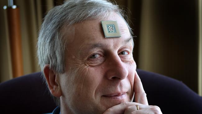 Cybernetics expert Kevin Warwick implants radio transmitters into his body.