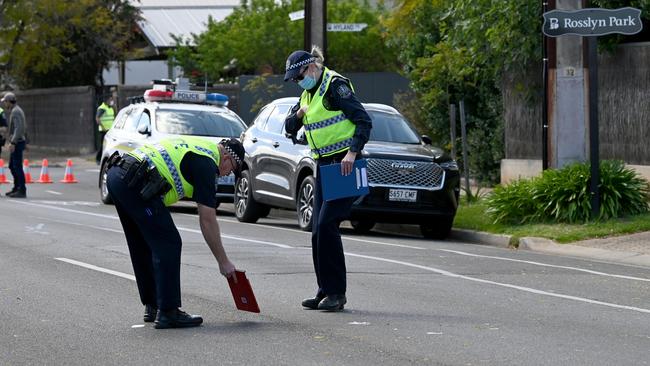 Police investigate the road where a boy was hit by a car. Picture: Naomi Jellicoe