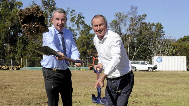 DIGGING IN: Kevin Hogan and Chris Gulaptis turn the first sod at the Dougherty Villa extension. Picture: Caitlan Charles