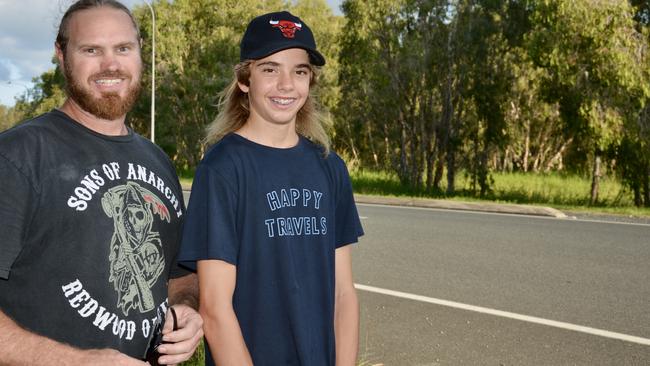 Clinton Barker, pictured with his son Dayne, said there were concerns children often walked along Hennessy Street and Bucasia Dump Rd where they saw a crocodile. Picture: Rae Wilson