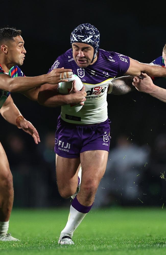 AUCKLAND, NEW ZEALAND - JUNE 15: Jahrome Hughes of the Storm is tackled during the round 15 NRL match between New Zealand Warriors and Melbourne Storm at Go Media Stadium Mt Smart, on June 15, 2024, in Auckland, New Zealand. (Photo by Phil Walter/Getty Images)