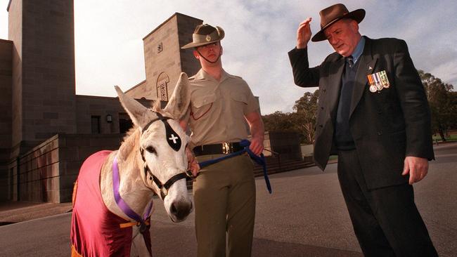 With ‘Simmo’, the Army Medical Corp mascot, and Private Eric Driessen of the 1st Field Hospital at the Australian War Memorial in 1997. Picture: Ray Strange