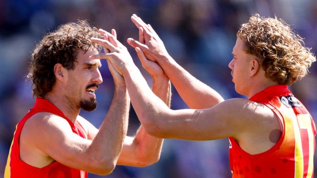 BALLARAT, AUSTRALIA – MARCH 24: Ben King of the Suns celebrates a goal with teammate Jed Walter during the 2024 AFL Round 02 match between the Western Bulldogs and the Gold Coast SUNS at Mars Stadium on March 24, 2024 in Ballarat, Australia. (Photo by Dylan Burns/AFL Photos via Getty Images)