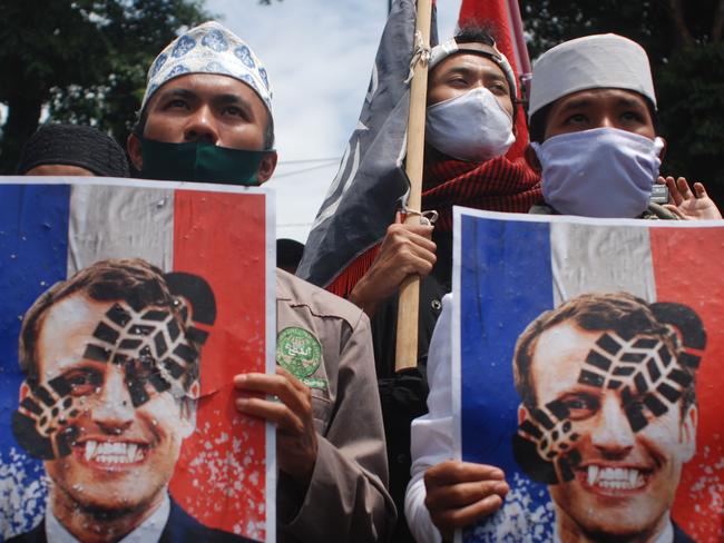 Muslim protesters gather to protest against French President Emmanuel Macron outside the French Institute in Bandung. Picture: Timur Matahari