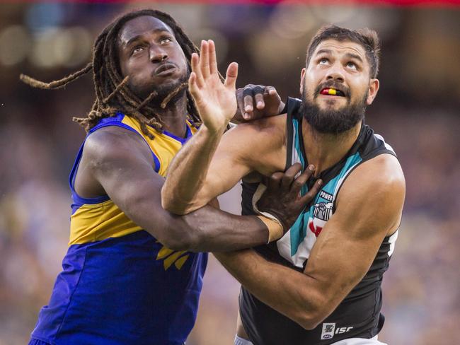 Nic Naitanui of the Eagles and Paddy Ryder of the Power contest the ball during the Round 7 AFL match between the West Coast Eagles and the Port Adelaide Power at Optus Stadium in Perth, Saturday, May 5, 2018. (AAP Image/Tony McDonough) NO ARCHIVING, EDITORIAL USE ONLY