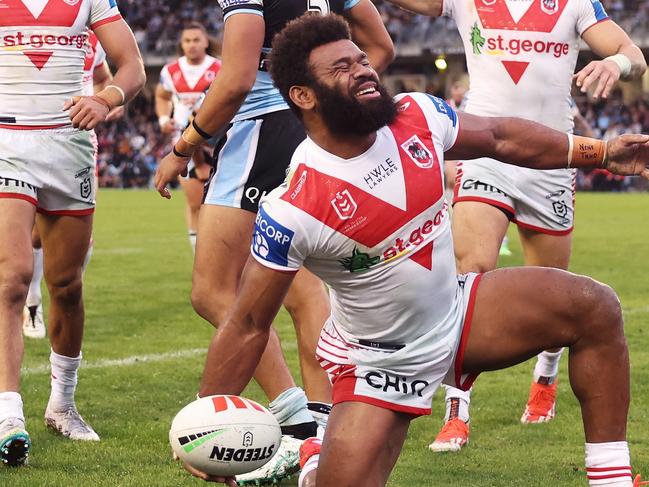 SYDNEY, AUSTRALIA - MAY 05:  Mikaele Ravalawa of the Dragons celebrates with team mates after scoring a try during the round nine NRL match between Cronulla Sharks and St George Illawarra Dragons at PointsBet Stadium, on May 05, 2024, in Sydney, Australia. (Photo by Matt King/Getty Images)