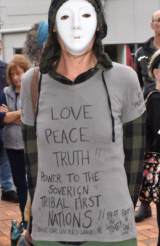 This protester was the only person in the crowd to wear a mask, though not the traditional Covid-safe precautionary measure.