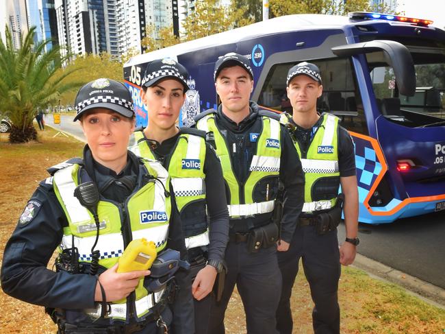 Sergeant Amy Balas, Constable Joanna Arena, Constable Ben Dowers and Constable Adam Bau in front of the first of the new fleet of alcohol and drug testing buses. Picture: Tony Gough